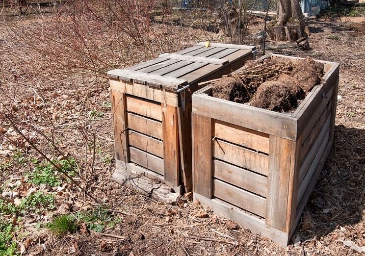 a wooden compost container