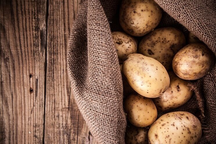 white potatoes on a wooden table