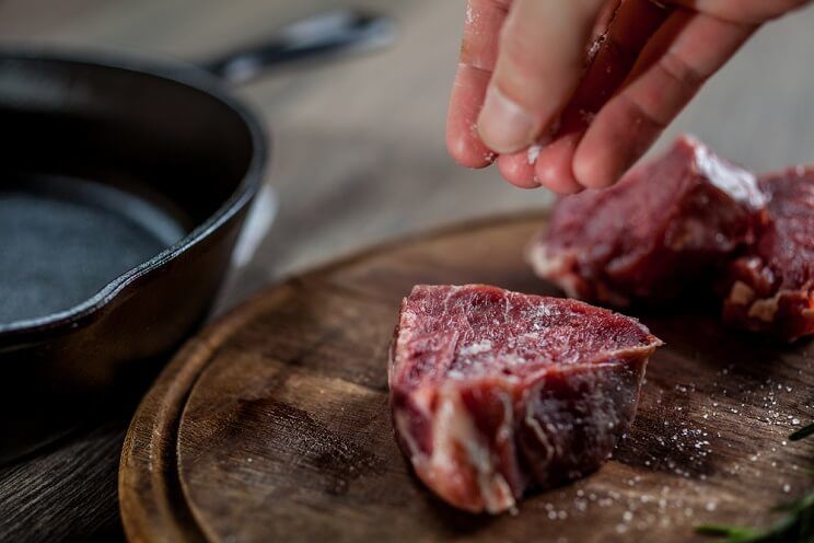 salting a raw steak