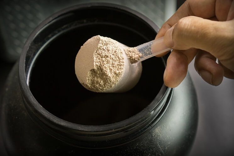 protein powder in a black container