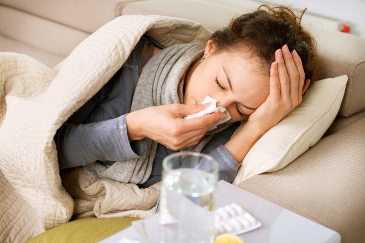 woman blowing her nose