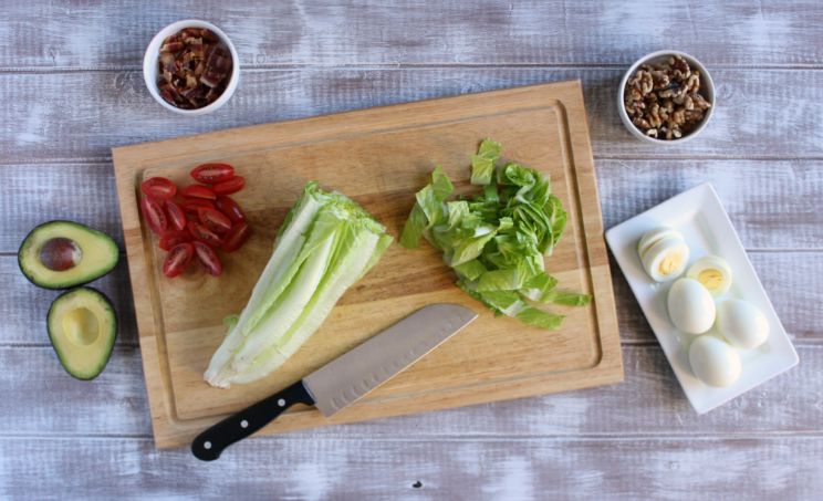 cobb salad ingredients on a chopping board