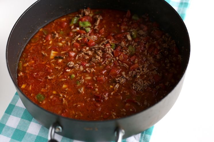 onion, pepper, and canned diced tomatoes in skillet