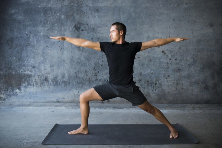 man practicing yoga