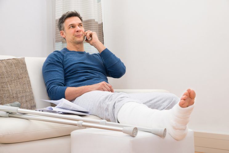 man with fractured leg
