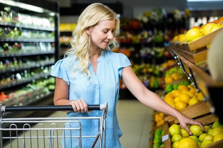 woman shopping for lemons