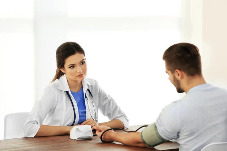 concerned doctor examining patient