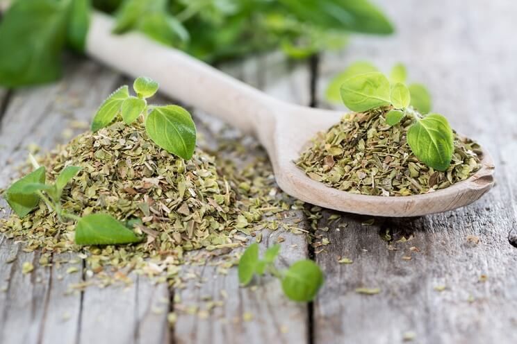 oregano on a wooden spoon