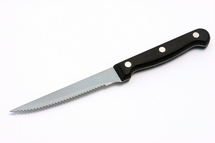 serrated knife on white background
