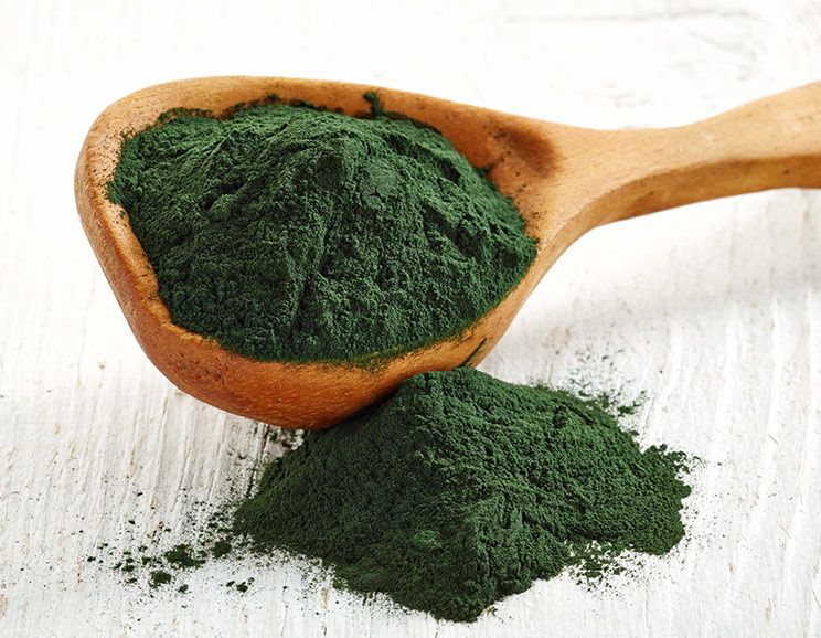 chlorella on a wooden spoon