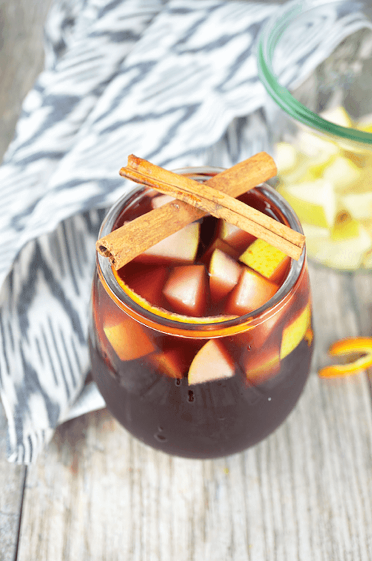 AIP red sangria in a glass with cinnamon sticks