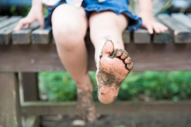 woman with dirty bare feet