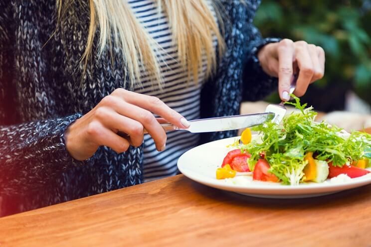 woman eating a salad