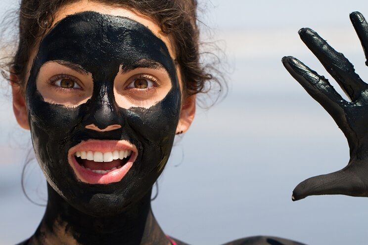 woman with clay mask