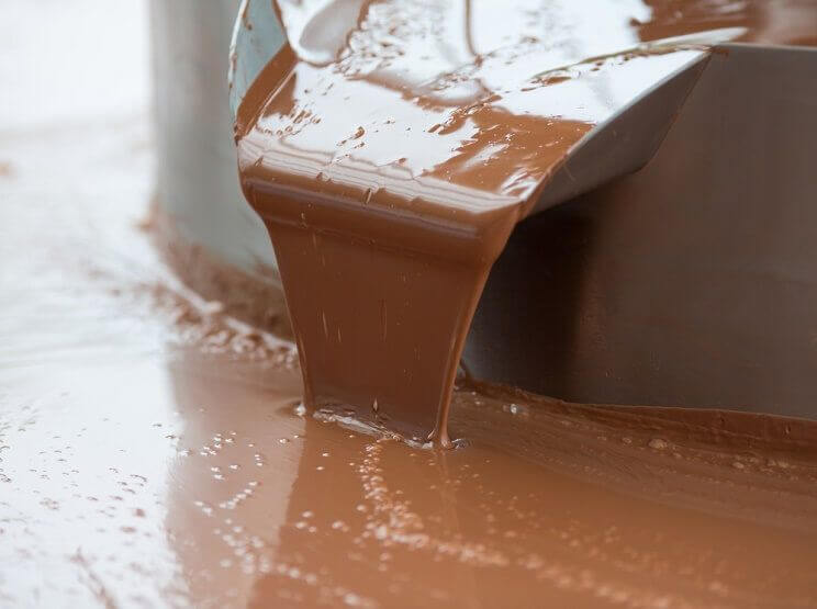 chocolate being poured at a factory