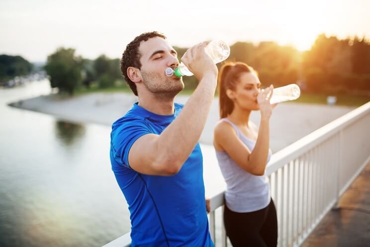 couple hydrating on bridge