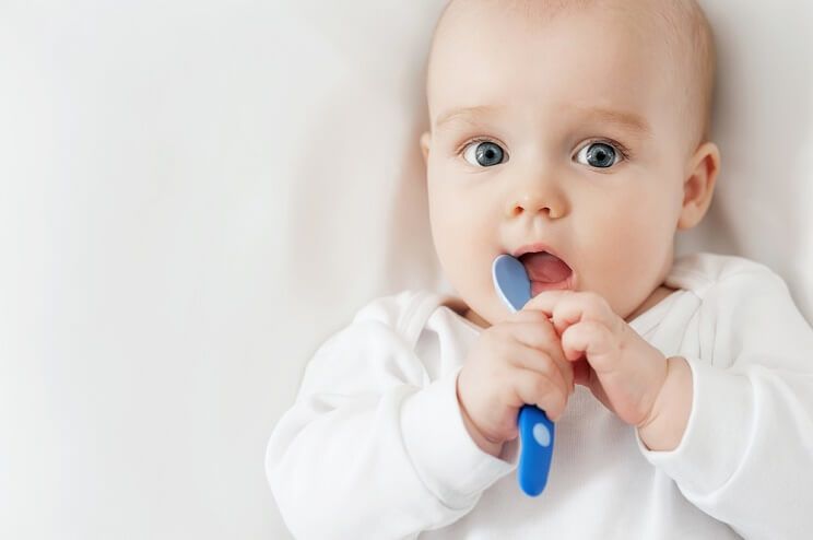 immune system learns - baby with a spoon