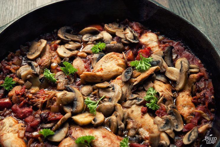 tuscan chicken with mushrooms in a skillet