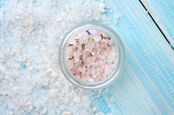 unrefined salts in a glass dish