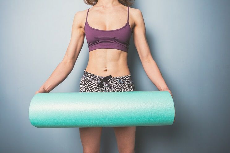 woman with foam roller