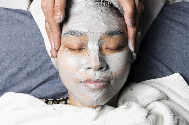 woman getting a charcoal facial
