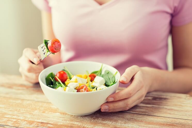 woman eating a healthy salad