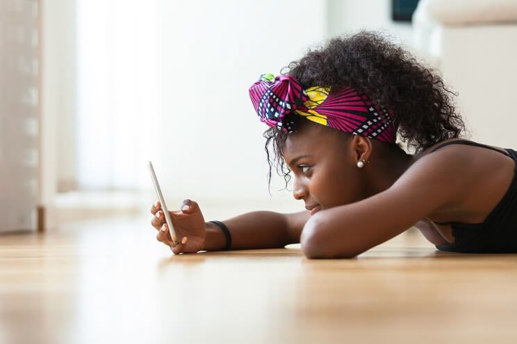 woman texting with poor posture