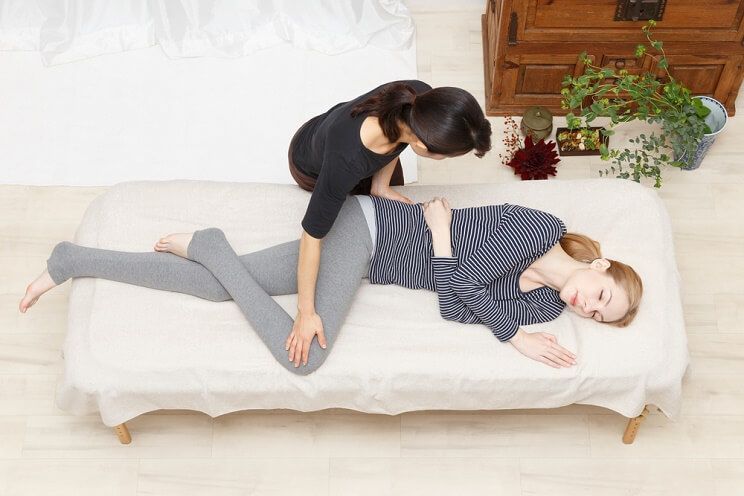 woman getting treated for sciatica by chiropractor