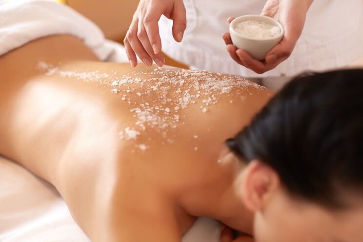 woman getting salt spa treatment