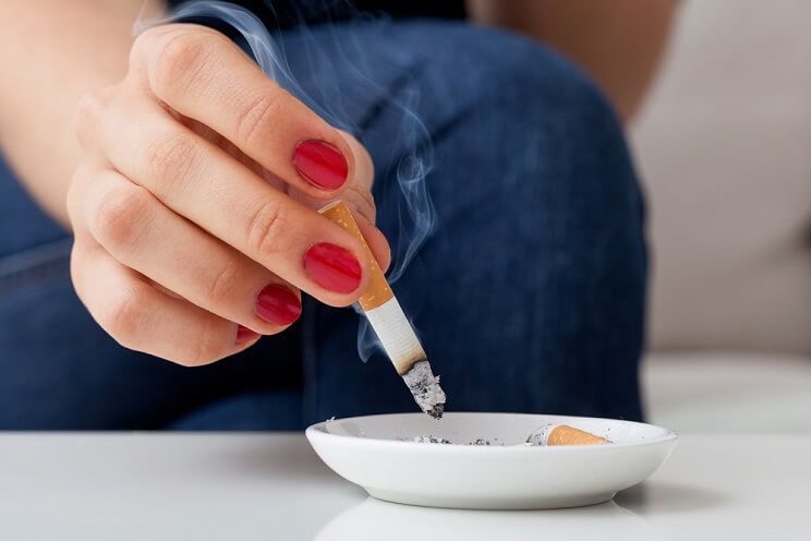 woman using ashtray