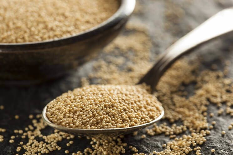 amaranth seeds on a spoon