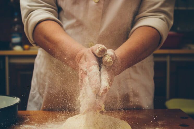 hands making bread