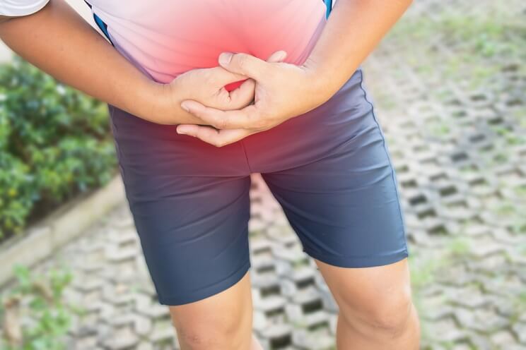 man holding stomach