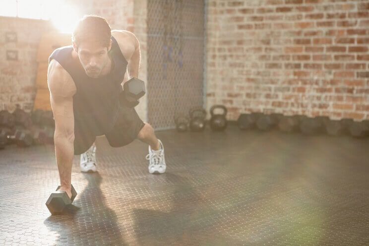 man lifting weights