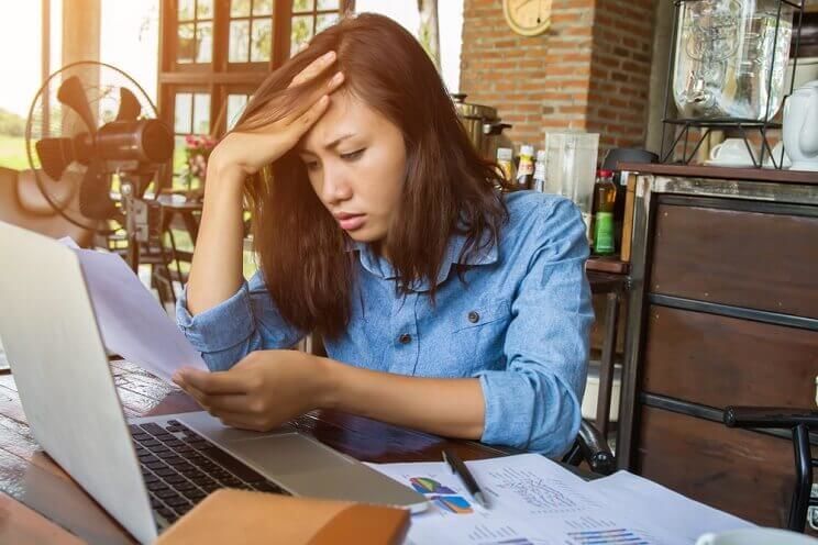 stressed woman on her laptop