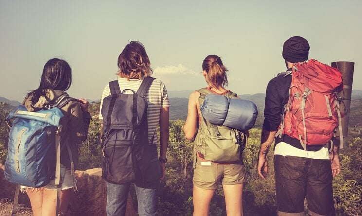 young adults traveling with backpacks