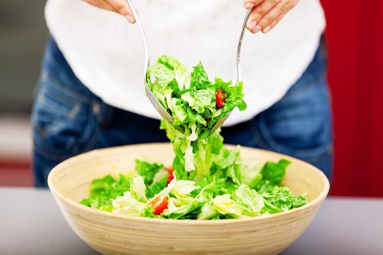 woman preparing a salad