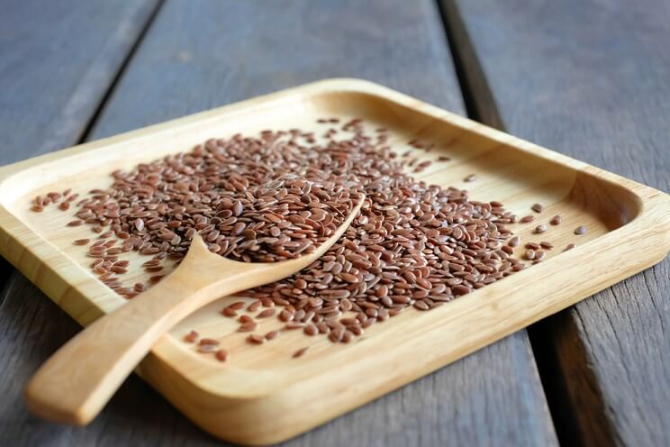 flaxseeds on a wooden board