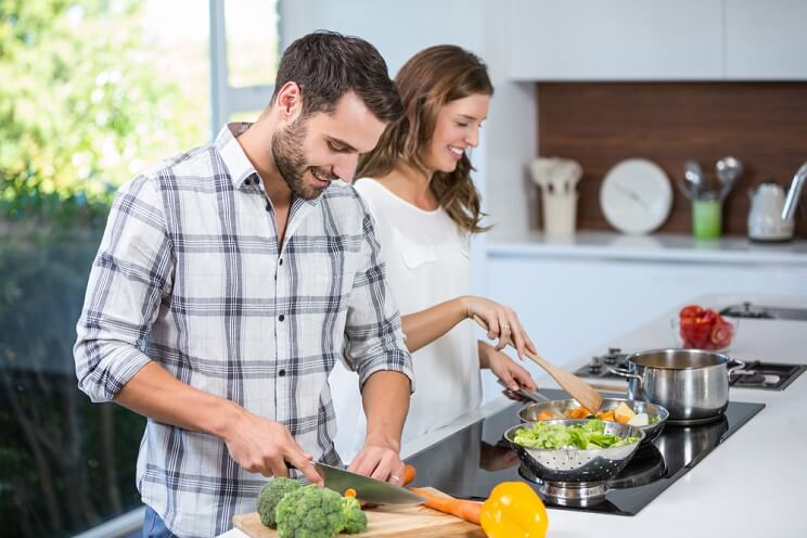 young couple preparing food