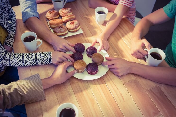 muffins and donuts on a conference table
