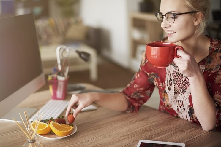 woman having a healthy snack at work