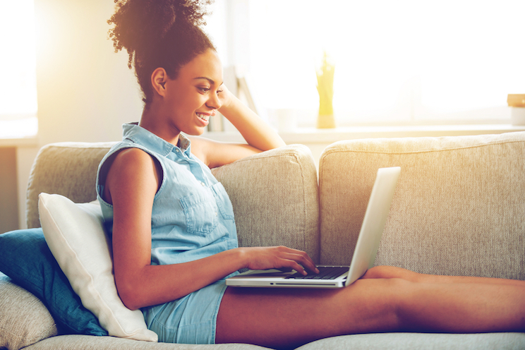 woman on computer smiling