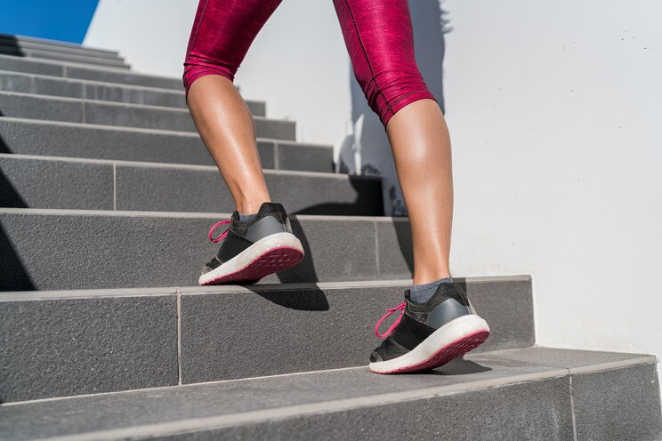 woman running up stairs