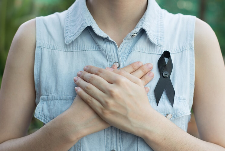 woman with cancer ribbon
