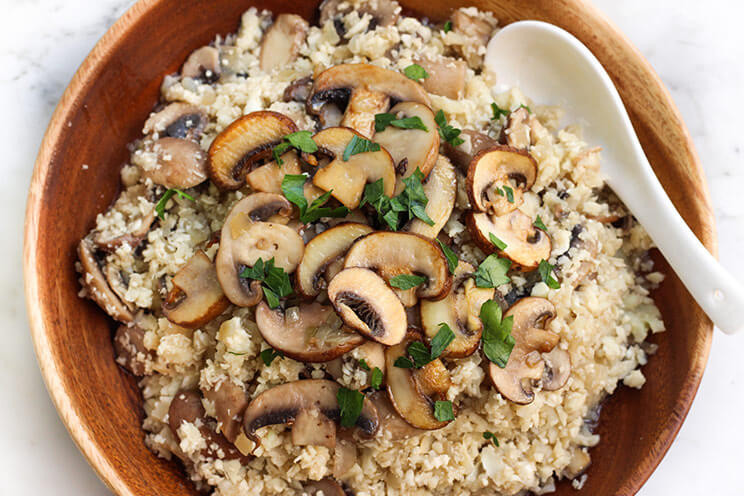 Cauliflower rice soaks up the savory flavors of garlic and beef in this Paleo version of mushroom risotto!