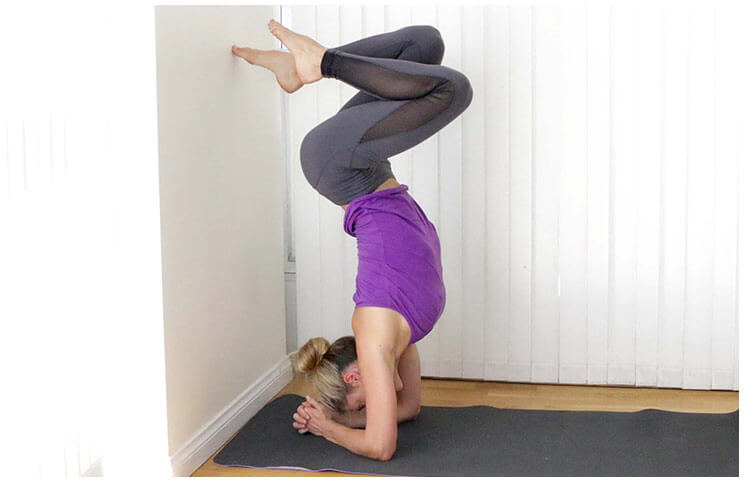 toe to wall headstand