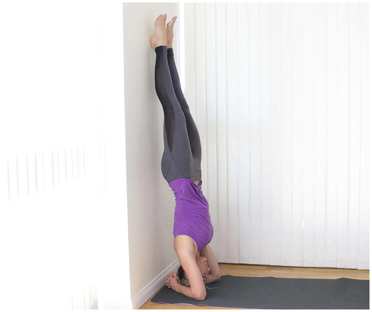 wall headstand yoga inversion