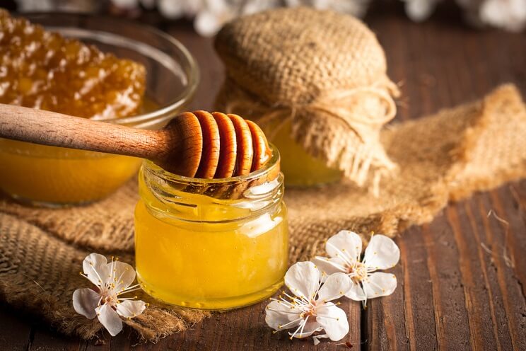 raw honey with flowers