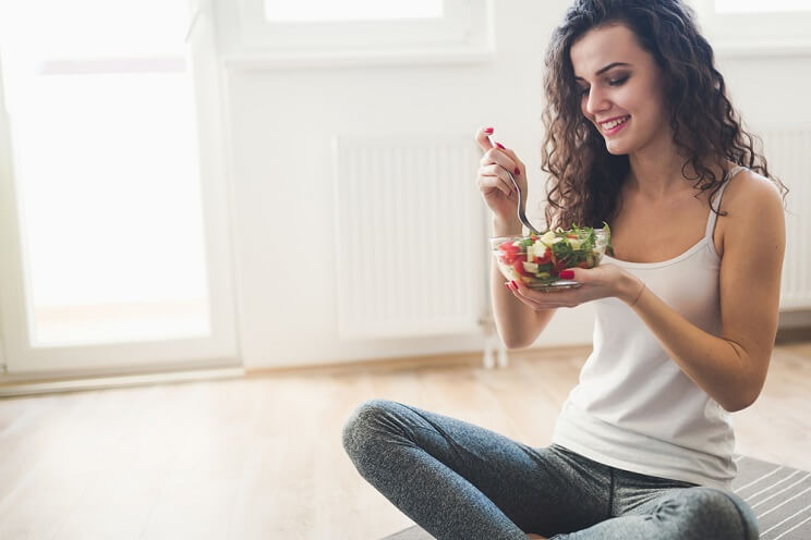 woman eating a salad