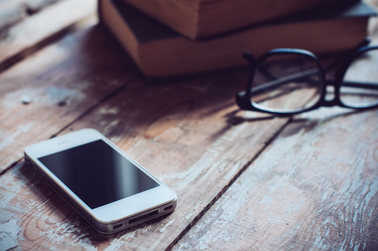 phone and glasses on a table